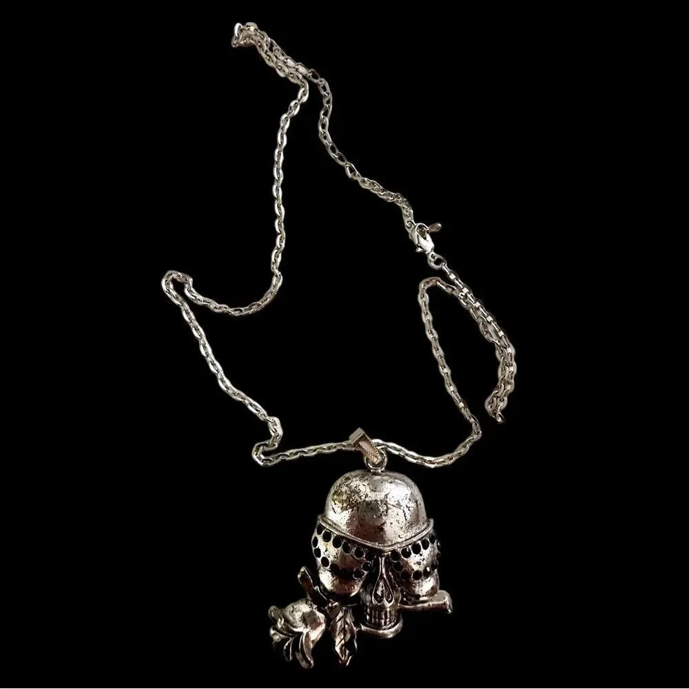 Vintage silver skull with black rhinestones and rose